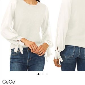 Cece cream colored sweater with tied cuffs